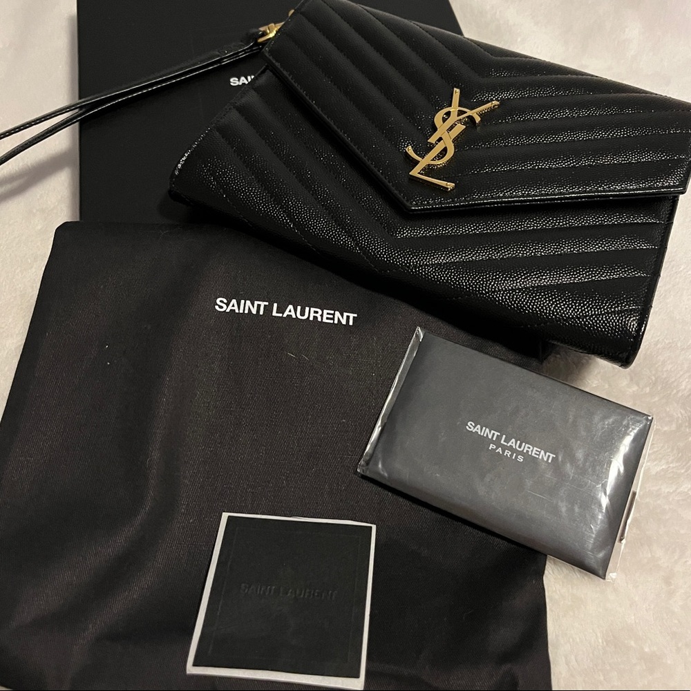 SOLD.  SOLD.   SOLD.       Yves Saint Laurent ‘YSL’ Monogram Clutch Gold Harware